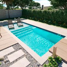 an empty swimming pool with chairs around it and plants in the back ground, surrounded by greenery