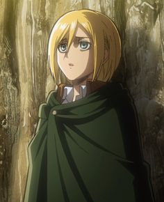 an anime character with blonde hair and blue eyes wearing a green cloak in front of trees