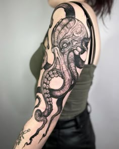 a woman with an octopus tattoo on her arm