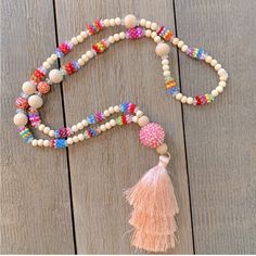 Bead And Tassel Handmade Necklace. Nwot Adjustable Wooden Beaded Necklace For Parties, Pink Beaded Necklaces For Festivals, Pink Beaded Necklace For Beach, Festival Pink Necklaces With Colorful Beads, Festival Pink Beaded Necklace, Pink Beaded Chain Necklace For Festival, Pink Wooden Beads For Gifts, Pink Faceted Bead Necklaces For The Beach, Pink Faceted Beads Necklaces For Beach