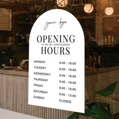 an open hours sign in front of a restaurant