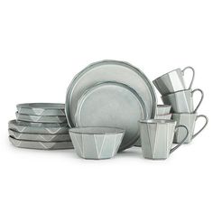 a set of dishes and cups with silver rims