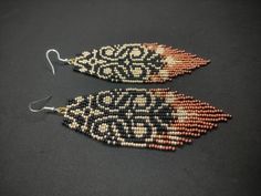 Black and Gold Lace Beaded Earrings Beadwork Fringe Aesthetic - Etsy Elegant Multicolor Handmade Beaded Earrings, Unique Beaded Earrings For Festive Occasions, Unique Festive Beaded Earrings, Bohemian Drop Earrings With Bead Caps, Unique Beaded Earrings With Bead Caps For Gift, Handmade Elegant Orange Beaded Earrings, Elegant Handmade Orange Beaded Earrings, Bohemian Bead Caps Earrings For Festival, Bohemian Festival Earrings With Bead Caps