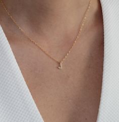 Delicate Initial Pendant Necklace With Delicate Chain, Delicate Initial Necklace With Pendant, Delicate 14k Gold Initial Pendant Necklace, Delicate Initial Pendant Name Necklace, Simple Tiny Initial Pendant Necklace, Minimalist Initial Pendant Necklace Gift, Delicate Initial Necklace For Anniversary With Delicate Chain, Elegant Tiny Initial Pendant Charm Necklaces, Dainty Initial Necklace With Delicate Chain For Anniversary