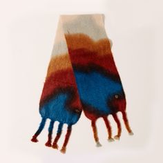 Looking for a warm scarf to bundle up on cold days and make a style statement at the same time? Meticulously crafted in a rich mohair and extra-fine wool blend using time-honored techniques, this heirloom-quality winter essential is so cozy you’ll never want to take it off. The unique tie-dye pattern, sumptuous texture, and knotted fringe make this scarf a beautiful piece of wearable art and a seasonal favorite. Harlem Candle Company, Ocean Agate, Abstract Scarf, Colour Abstract, Knotted Fringe, Tie Dye Scarves, Heritage Crafts, Home Decor Brands, Unique Ties