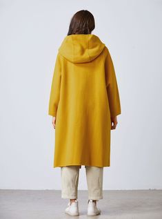 DETAILS: * 50% wool, 50% fiber,nylon * Has no lining * the model is 172 cm high and the model is wearing the coat in XS. * color in the picture show. * A big hood with a long tie at the neck . * No buttons. * Two pockets in seam. * Below knee length. * Dry clean. SIZE & FIT - XS-XL Available - Check the size Chart & instruction with the last photo of this listing - Model Info: Height: 172 cm | Bust: 84 cm | Waist: 64 cm | Hips: 91 cm | Size:XS PERSONALIZATION What I can do - Adjust the s Oversized Solid Color Cape Outerwear, Solid Hooded Cape For Fall, Hooded Wool Cape For Winter, Oversized Wool Cape Coat For Fall, Oversized Wool Hooded Outerwear, Yellow Oversized Hooded Outerwear, Yellow Wool Outerwear For Winter, Mustard Yellow Coat, Long Wool Coat Women