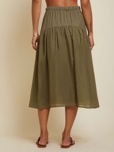 This vintage-inspired midi skirt features an elastic waistband, contrast voile tier and that oh-so-flattering yoke shape that accentuates all the right curves. The perfect throw-on-and-go piece to add a feminine touch to your favorite tee and sandals combo. (This one comes in Ivy.) Wear it with the Cameo Tank. | Women's Helena Skirt in Ivy | Ethical Essentials Flowy Summer Midi-length Bottoms, Spring Midi Length Gathered Skirt, Beach Midi-length Gathered Skirt, Midi Length Gathered Skirt For Beach, Summer Voluminous Skirt With Elastic Waistband, Voluminous Summer Skirt With Elastic Waistband, Vacation Midi Length Gathered Skirt, Summer Midi Gathered Skirt, Summer Midi Skirt With Gathered Detail