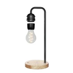 a black lamp with a wooden base and light bulb