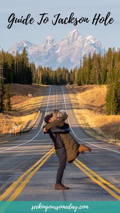 a couple kissing on the road with mountains in the background and text overlay that says, guide to jackson hole