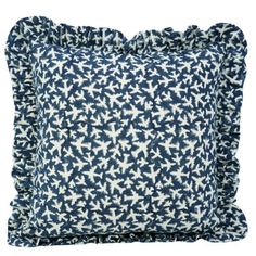 two blue and white pillows with ruffled edges