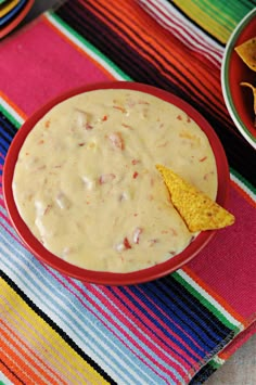 a bowl of quesadilla dip with tortilla chips on the side