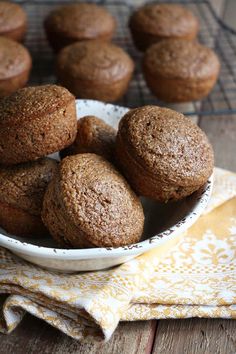 a bowl filled with muffins on top of a table