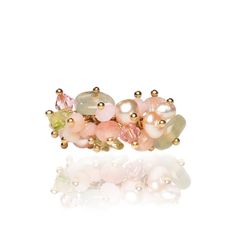 "Introducing the exquisite Mermaid Ring, a unique creation crafted with precision and care. This handmade beauty features a delicate blend of freshwater pearls, Austrian crystals, prehnite quartz, and enchanting green and pink tourmaline chips reminiscent of the ocean's allure. The ring is elegantly set on a 24-karat gold-plated adjustable band, adding a touch of sophistication. Embrace the whimsical charm of this special piece, a perfect addition to your collection or a thoughtful gift for someone dear. Dive into elegance with the Mermaid's Ring and let its beauty enchant your style. Limited availability, so secure yours now and make a splash with this captivating accessory. Style R026 This exquisite ring is crafted in the United States. Materials prehnite quartz pink freshwater pearls pi Mermaid Ring, Quartz Pink, Beauty Features, Pearl Pin, Creation Crafts, Handmade Beauty Products, Coastal Wedding, Rose Lights, Quartz Rose