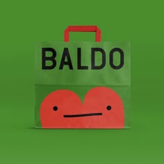 a green bag with a red heart on it and the word baldo written in black