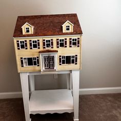 a doll house on top of a white table