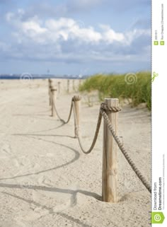 the rope is attached to the posts on the beach