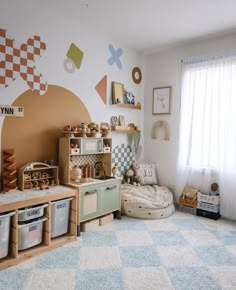 a child's playroom with toys on the floor