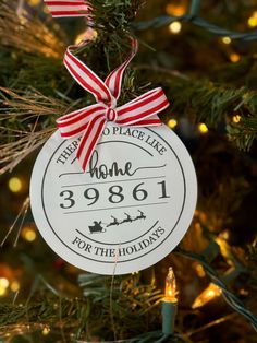 a personalized ornament hanging from a christmas tree