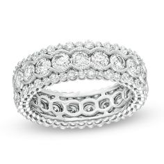 a white gold and diamond ring with rows of round diamonds on each band, set in 18k white gold