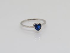 Vintage Sterling Silver Blue Sapphire Heart Ring....Marked 925...Total of weights 1.2grams... Size 7...Measure of Face 6MM...It's in very good condition. A Elegant Blue Heart Ring For Valentine's Day, Blue Birthstone Heart Ring As Gift, Blue Birthstone Heart Ring For Gift, Blue Sterling Silver Heart Ring Gift, Blue Sterling Silver Heart Ring For Anniversary, Blue Heart Sterling Silver Ring For Gift, Blue Round Heart Ring As Gift, Blue Heart Cut Promise Ring, Blue Sterling Silver Heart Ring