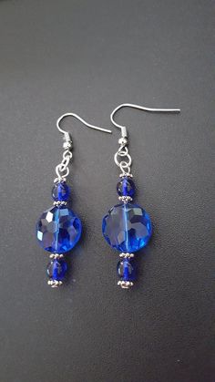 Teardrop Crystal Earrings With Faceted Beads, Silver Dangle Crystal Earrings With Faceted Beads, Sterling Silver Beaded Crystal Earrings, Blue Drop Crystal Earrings, Sapphire Crystal Drop Earrings, Blue Crystal Drop Earrings, Elegant Blue Crystal Earrings With Dangling Beads, Blue Beaded Round Crystal Earrings, Blue Beaded Crystal Earrings With Round Beads