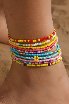 This multi-layered beaded anklet set features a beautiful yellow flower design with random color beads. Each layer adds depth and charm, making it the perfect accessory for any summer outfit. Handcrafted with precision and attention to detail, this anklet set is sure to make a statement. Beaded Anklet, Ankle Jewelry, Tiny Beads, Bohemian Aesthetic, Bright Eye, Color Beads, Plastic Crafts, Next Fashion, Layered Design