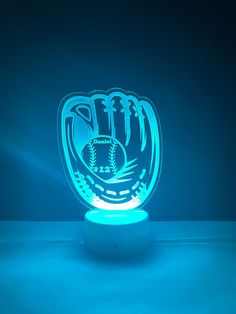 a light up baseball glove with palm trees on it