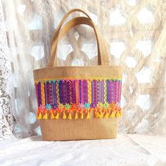 Immerse yourself in the summer spirit with our magnificent hippie boho burlap basket tote bag in vibrant purple and yellow. This colorful and cheerful accessory is perfect for sunny days, beach walks and summer getaways. In addition to being trendy, this bag embodies the boho spirit with its natural burlap texture, its ethnic fabric and its ribbon and braid ornaments. Its large capacity and natural cotton canvas lining allow you to easily carry everything you need during your summer outings. Let Spring Floral Prints, Boho Tote Bag, Unique Tote Bag, Boho Tote, Beach Walks, Basket Tote, Pink Spring, Purple And Yellow, Vibrant Purple