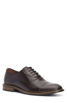 A rich leather upper and cap toe add timeless sophistication to a streamlined oxford that will complement your sleek looks. Lace-up style Leather upper/synthetic and textile lining/rubber sole Imported Business Casual Cap Toe Derby With Leather Lining, Brown Cap Toe Oxfords For Derby, Classic Leather Derby With Cap Toe, Fitted Brown Oxfords For Derby, Brown Dress Shoes With Rubber Heel Cap For Derby, Classic Leather Derby Shoes With Rubber Heel Cap, Classic Leather Derby With Rubber Heel Cap, Brown Derby Shoes With Leather Footbed For Business, Brown Business Derby With Leather Footbed