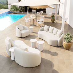 an outdoor living area with white furniture next to a swimming pool