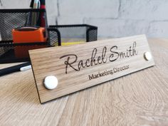 A beautiful, exclusive personalized desk stand with name. A perfect decoration for any office or anywhere where there is direct contact with the customer. Three types of beautiful wood to choose from. Each board has its own unique grain and color, which adds originality and character. Each name desk plaque is carefully hand-sanded and protected with colorless wood oil. Desk signs are made with a precise laser from solid wood and two metal supports.  Please write to us if you need signs in a diff Office Door Name Plates, Desk Signs, Engraved Name Plates, Glowforge Ideas, Office Desk Name Plates, Desk Plaques, Personalized Desk, Desk Name Plate, Laser Engraved Ideas