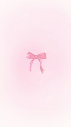 a pink bow on a light pink background