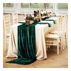 the table is set with green and white linens