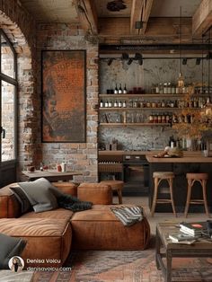 a living room filled with furniture and a brick wall