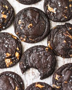 chocolate cookies with orange peels and cheese on top