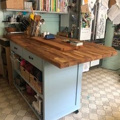 a kitchen island with lots of drawers in it