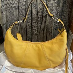 Worthington Genuine Leather Yellow Purse Shoulder Bag Hand Bag Casual Or Dressy. Side Tassell With Zipper Compartment. Inside Zipper Compartment Plus Two Inside Pockets. Yellow Lining. Lightweight. Medium Size. Condition : Fair. Although I've Never Used This Bag I Am Seeing A Few Tiny Flaws. Not Very Noticeable But Just Being Transparent. Price Reflects This. Casual Yellow Satchel Affordable, Elegant Leather Hobo Bag For Spring, Elegant Hobo Bag With Detachable Handle For Spring, Elegant Spring Hobo Bag With Detachable Handle, Elegant Spring Hobo Bag For Shopping, Elegant Spring Hobo Bag For Daily Use, Elegant Summer Hobo Bag, Spring Leather Hobo Bag, Spring Soft Leather Hobo Bag