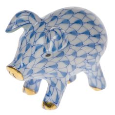 a blue and white pig figurine on a white background