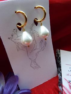 Pearls are timeless. These are South Sea Shell Pearls with gold-plated hoop leverbacks, gold-filled earwires or leverbacks, and/or sterling silver earwires or leverbacks. They look perfect with ANYTHING - even pajamas. SS is Sterling Silver, GF is Gold Filled, LB is Leverback, and EW is Earwire. They hang about 1-1/4 inches long. The pearls are beautiful, and I also have them in a very light pink pearl. The champagne pearl version is glass. If you do not have pierced ears, I have very nice clip- Gold Teardrop Earrings With Lever Back As Gift, Classic Clip-on Hoop Earrings As Gift, Gold Teardrop Earrings As Gift, White Clip-on Hoop Earrings For Gift, White Clip-on Hoop Earrings As Gift, Handmade Elegant Hoop Huggie Earrings, Elegant Handmade Hoop Huggie Earrings, Elegant Handmade Huggie Hoop Earrings, Elegant Handmade Drop Huggie Earrings