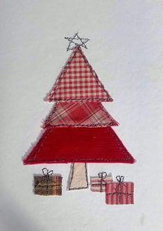 a small christmas tree made out of fabric