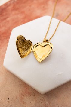 The Love Me Heart Heart Locket Necklace is the perfect way to show someone you care. Available in gold and silver, this cute necklace is a perfect gift for any occasion. Spread love and happiness with this adorable accessory. #lovemyleto #completeyourlook 100% Stainless Steel Imported