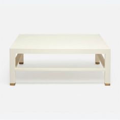 a white coffee table sitting on top of a white floor