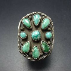 "VINTAGE NAVAJO RING DESCRIPTION: This exquisite old ring will be a treasured addition to your collection of fine vintage Native American jewelry. MEASUREMENTS: Ring face measures 1\" x 3/4\" RING SIZE: 7 WEIGHT: 7.0 grams SIGNED: no STERLING: unmarked, verified sterling silver"