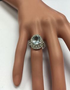 5.85 Carats Natural Aquamarine and Diamond 14K Solid White Gold Ring Suggested Replacement Value: $9,200.00 Total Natural Oval Cut Aquamarine Weights: 3.60 Carats Aquamarine Measures: 11.44 x 8.71mm Natural Round Diamonds Weight: 2.25 Carats (color G / Clarity VS2-SI1) Ring total weight: 6.9 grams Disclaimer: all weights, measurements and colors are approximate and may vary slightly from the listed dimensions or as seen in the image. All pictures are magnified to show the smallest of details. Pl Luxury Platinum Topaz Ring With Accent Stones, Designer Diamond Rings With Gemstones, Luxury Diamond White Topaz Ring For Formal Occasions, Exquisite Multi-stone Platinum Jewelry, Dazzling Diamond Ring With Accent Stones For Formal Occasions, Dazzling Multi-stone Platinum Jewelry, Luxury Diamond And Topaz Multi-stone Ring, Luxury White Gold Topaz Ring With Multi-stone, Luxury 14k White Gold Topaz Ring