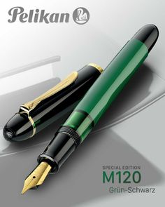 a green and black pen with gold trim