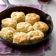 a pan filled with biscuits sitting on top of a table