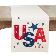 an american flag table runner with stars and the word usa on it in red, white, and blue