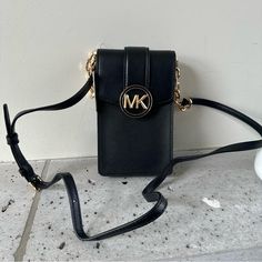 Nwt= Brand New With Tag Fast Shipping Smoke Free Enviro Pet Free Home Nwt Michael Kors Carmen Small Faux Leather Phone Crossbody Bag Crossbody Bag Faux Saffiano Leather 88.92% Coated Canvas/11.08% Polyester Trim: 100% Polyurethane Gold-Tone Hardware 4.25”W X 7”H X 1.25”D Interior Details: 3 Card Slots Lining: 100% Polyester Snap Fastening Imported Michael Kors Mobile Phone Bag, Gold-tone Hardware Crossbody Phone Bag For Travel, Michael Kors Crossbody Shoulder Bag With Mobile Phone Bag, Michael Kors Crossbody Mobile Phone Bag, Michael Kors Mobile Phone Crossbody Bag, Trendy Michael Kors Crossbody Bag, Michael Kors Crossbody Shoulder Bag With Cell Phone Pocket, Michael Kors Crossbody Bag With Cell Phone Pocket, Chic Michael Kors Shoulder Bag With Phone Pocket