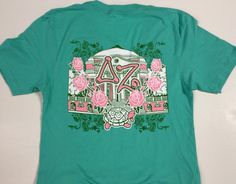 a green t - shirt with pink roses and the letter z on it's chest