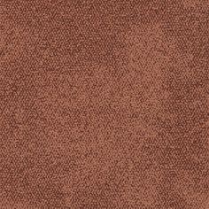 a brown carpet with small dots on it